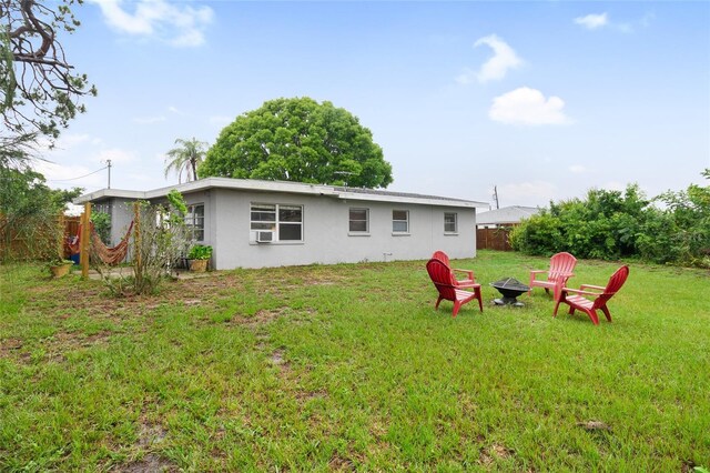 view of yard with a fire pit