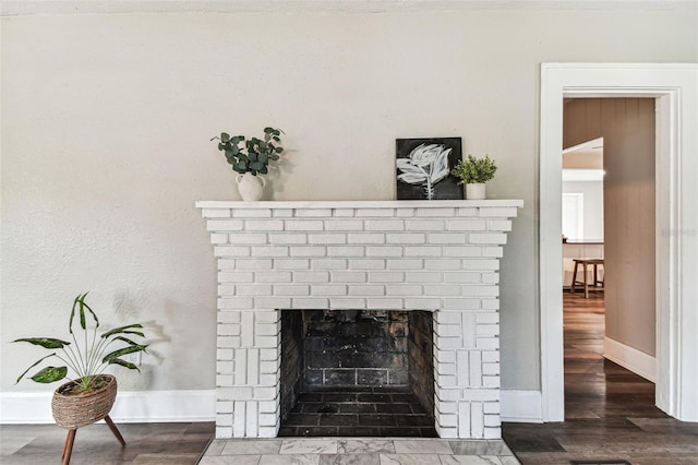 details featuring hardwood / wood-style floors and a fireplace