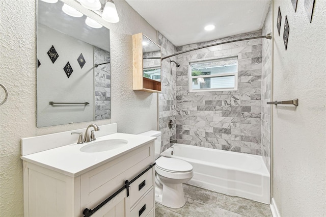 full bathroom with tiled shower / bath combo, toilet, and vanity