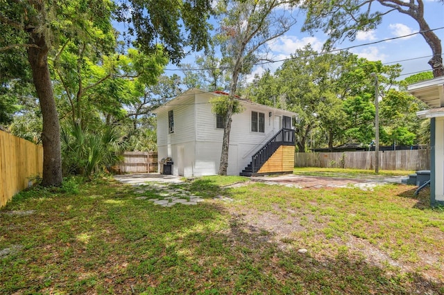 rear view of property with a patio area and a yard