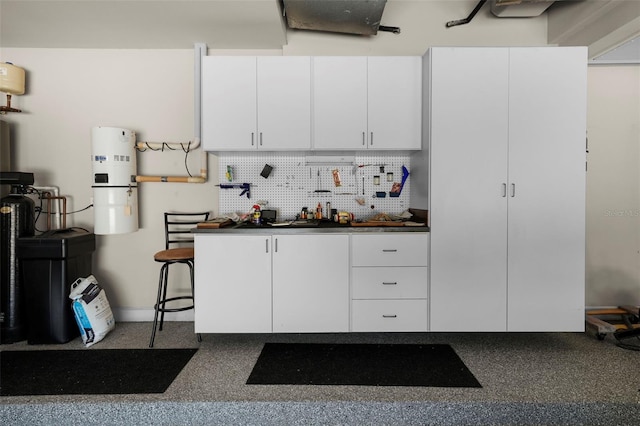 kitchen featuring white cabinets and tasteful backsplash