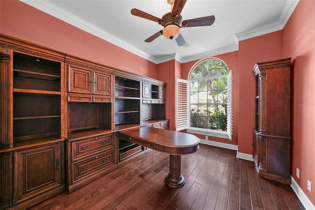 home office with dark wood-type flooring, ceiling fan, and ornamental molding