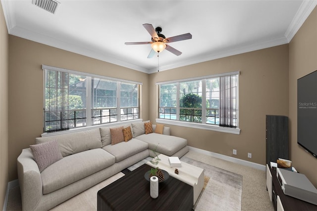 carpeted living room with ceiling fan and ornamental molding