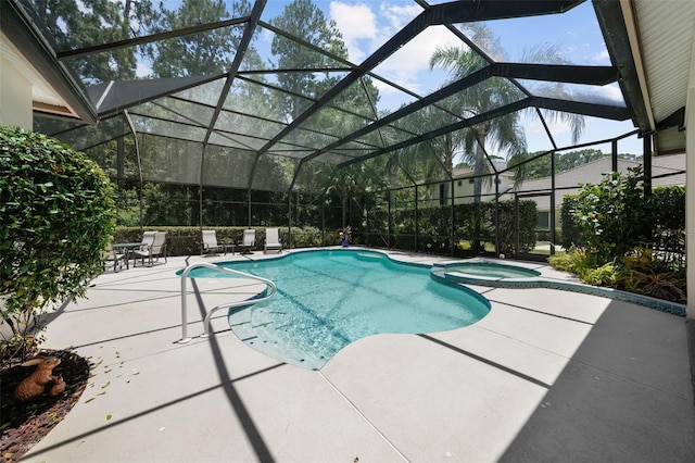 view of swimming pool featuring a lanai, an in ground hot tub, and a patio area