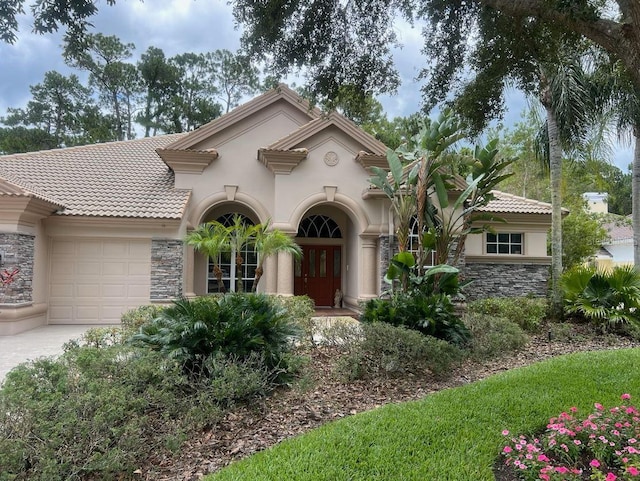 mediterranean / spanish house with a garage