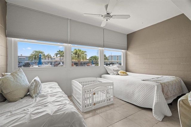 bedroom featuring ceiling fan and light tile patterned floors