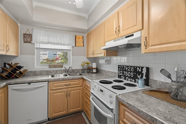 kitchen with crown molding, white appliances, light brown cabinetry, and sink