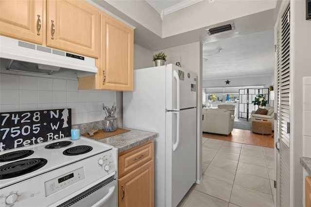 kitchen with light brown cabinetry, backsplash, light tile patterned floors, crown molding, and white appliances