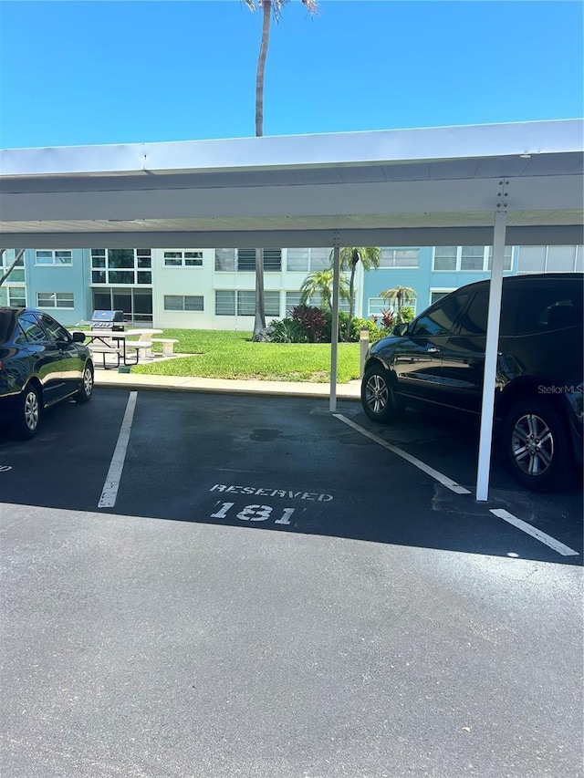 view of parking / parking lot with a carport