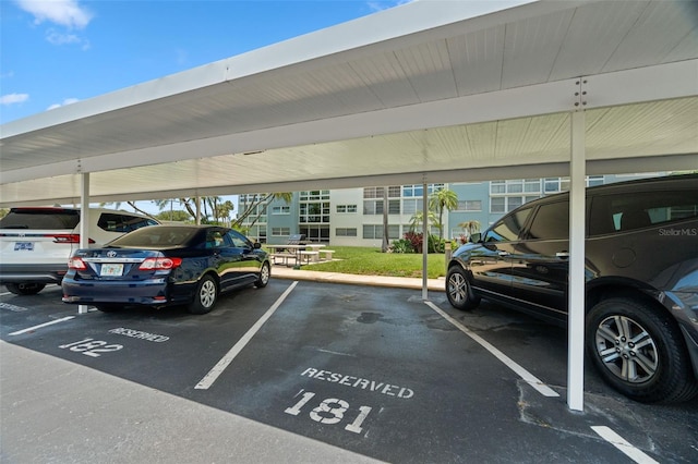 view of parking / parking lot featuring a carport