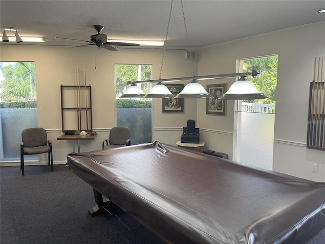 playroom with ceiling fan, pool table, a textured ceiling, and a wealth of natural light