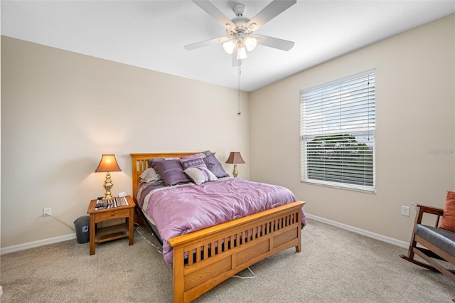 bedroom with ceiling fan and light carpet