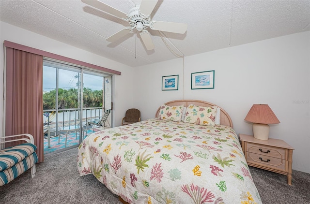 carpeted bedroom featuring access to exterior, a textured ceiling, and ceiling fan