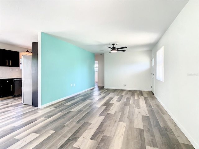 unfurnished living room featuring light wood-type flooring and ceiling fan