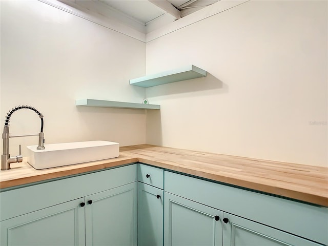 kitchen with butcher block counters and sink