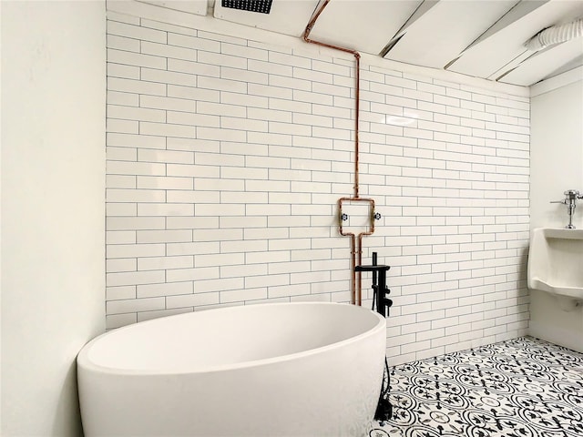 bathroom with a washtub