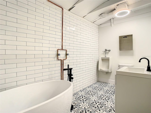 bathroom with vanity, a tub to relax in, and tile patterned floors