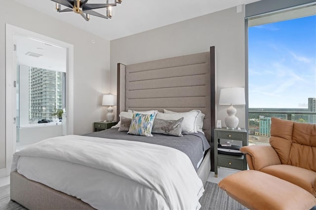 bedroom featuring a notable chandelier