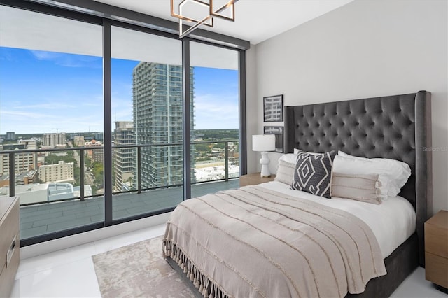 tiled bedroom with expansive windows and access to outside