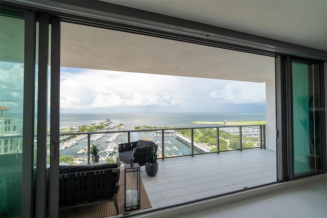 balcony featuring a water view