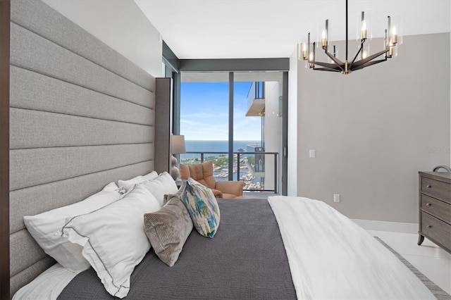 bedroom featuring tile patterned floors, floor to ceiling windows, a water view, a chandelier, and access to exterior