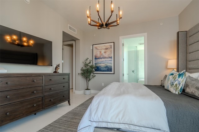 bedroom with light tile patterned flooring and ensuite bathroom