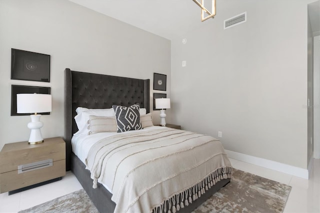 tiled bedroom with baseboards and visible vents