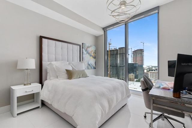 tiled bedroom featuring expansive windows