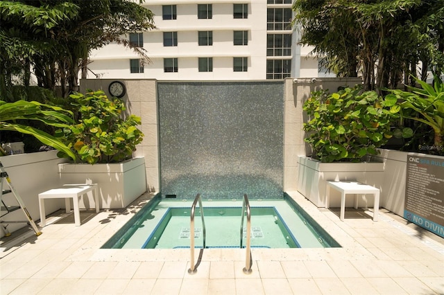 view of pool featuring a community hot tub