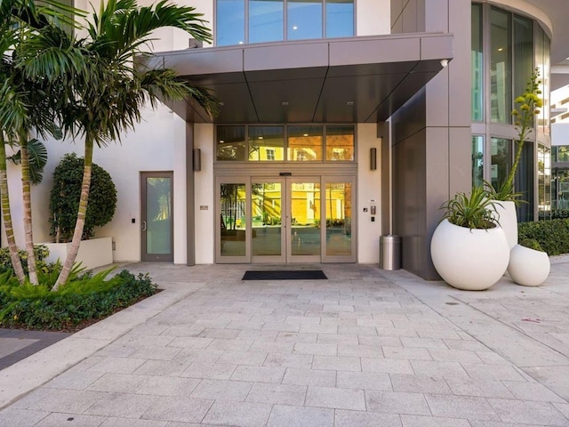 entrance to property featuring french doors and elevator