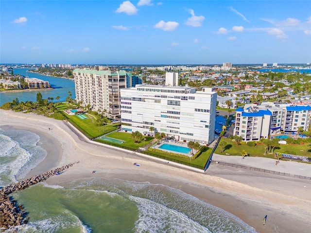 birds eye view of property with a beach view and a water view