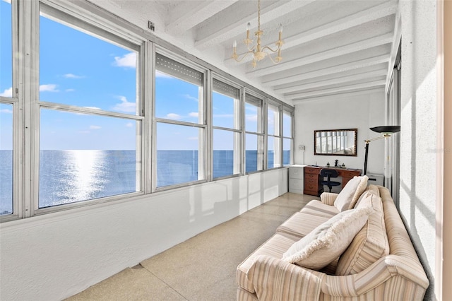 sunroom featuring beam ceiling, a water view, and a chandelier