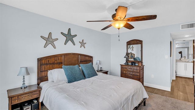 bedroom featuring ceiling fan and light hardwood / wood-style flooring