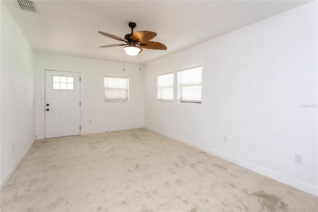 carpeted empty room with ceiling fan