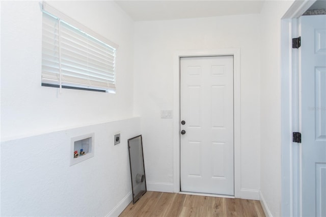 washroom featuring hookup for an electric dryer, light wood-type flooring, and washer hookup