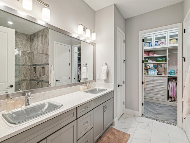 bathroom featuring vanity and a shower with door