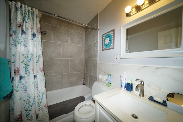 full bath with tile walls, shower / bathtub combination with curtain, toilet, and vanity