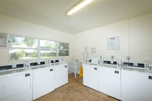 laundry room featuring sink and separate washer and dryer