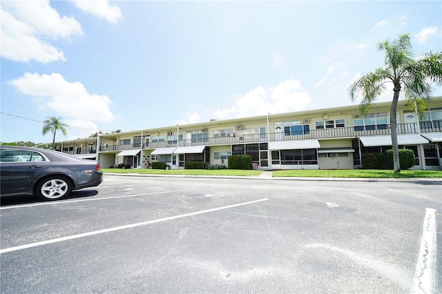 view of property with uncovered parking