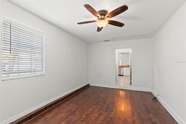 spare room with ceiling fan and dark wood-type flooring