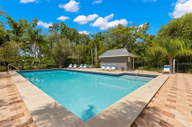 view of swimming pool featuring a patio