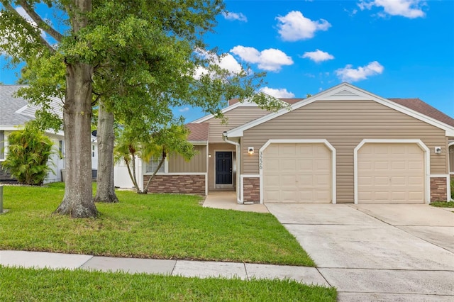 single story home with a front yard and a garage