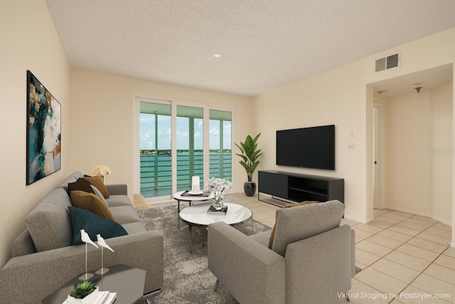 tiled living room with a textured ceiling