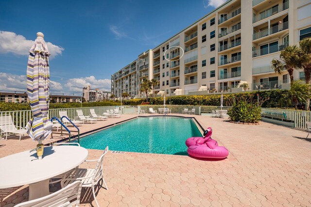 view of swimming pool with a patio