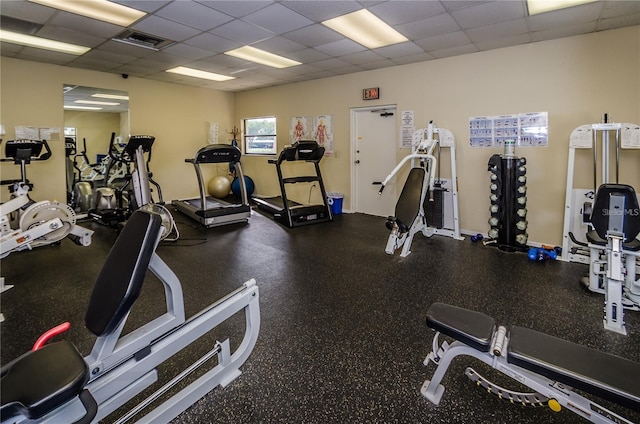 workout area with a drop ceiling