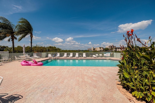 view of swimming pool with a patio