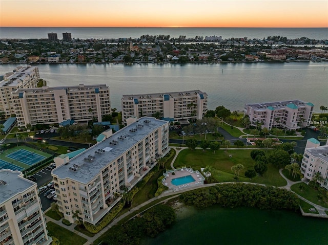 aerial view at dusk with a water view