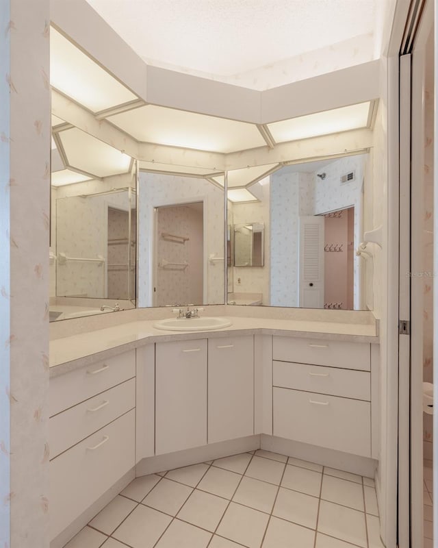 bathroom featuring tile patterned floors and vanity