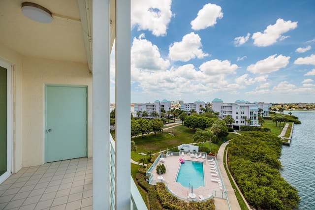 balcony featuring a patio and a water view