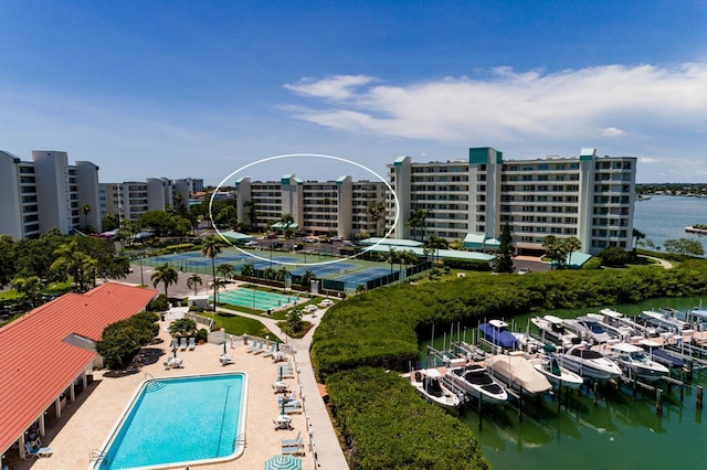 birds eye view of property with a water view